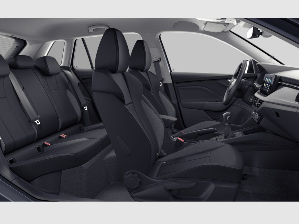 Dark fabric car interior with front and rear seats, steering wheel, and center touchscreen visible from the passenger side perspective