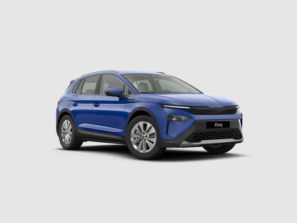 Front three-quarter view of a blue Skoda SUV with roof rails and prominent black grille.