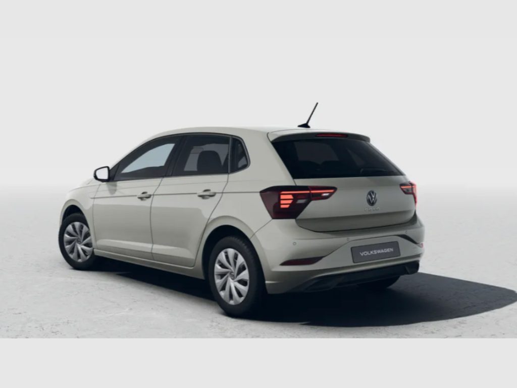 Rear-left three-quarter view of a white Volkswagen SUV, showing taillights and VW badge on the tailgate.