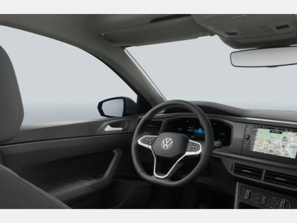 Interior view of a modern VW car: steering wheel with logo, digital instrument cluster, and a large navigation map on the center touchscreen.