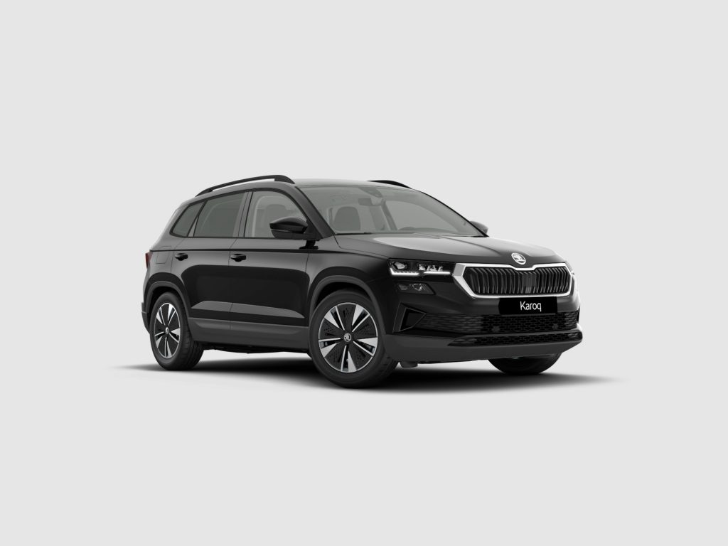 Front-right three-quarter view of a black Skoda Karoq SUV with roof rails on a light gray background with a visible chrome grille.