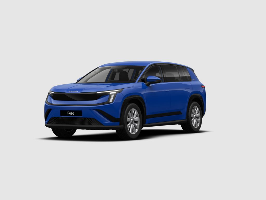 Front-left quarter view of a blue Skoda Peaq SUV against a neutral gray background, showing distinctive grille and headlights.