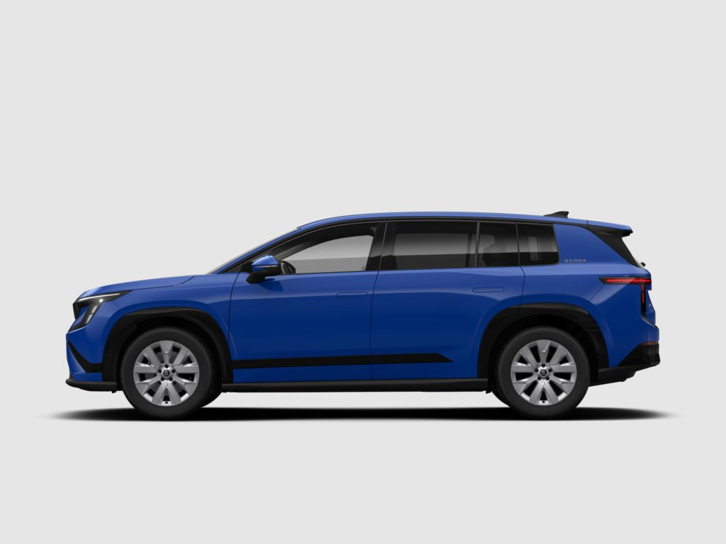 Side profile of a blue Skoda SUV, showing the front to midsection, wheels, and rear light against a light gray background.