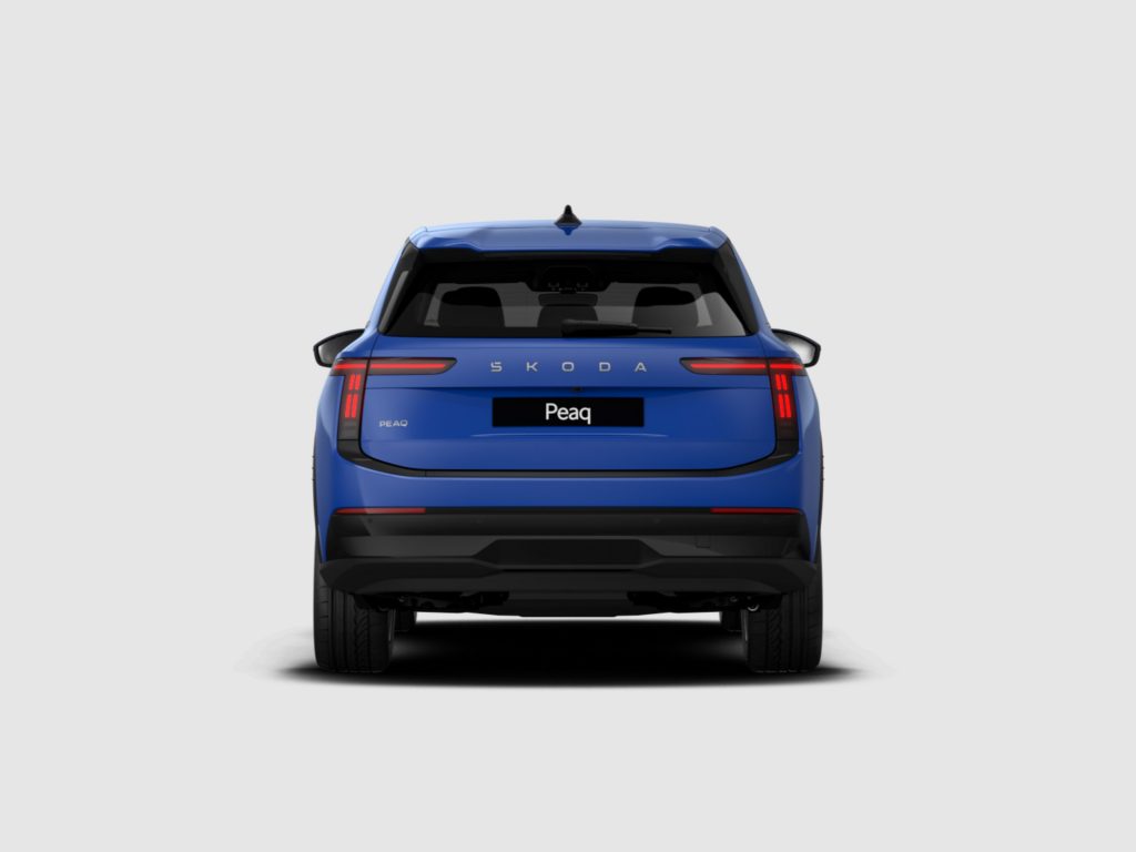 Rear view of a blue Skoda Peaq SUV, showing the vertical taillights and rear windshield.