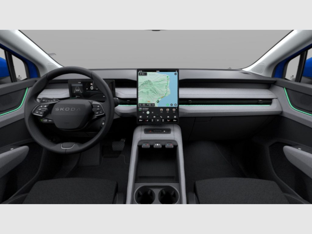Interior of a modern car from the driver’s seat showing a vertical touchscreen map on the center console and a Skoda steering wheel