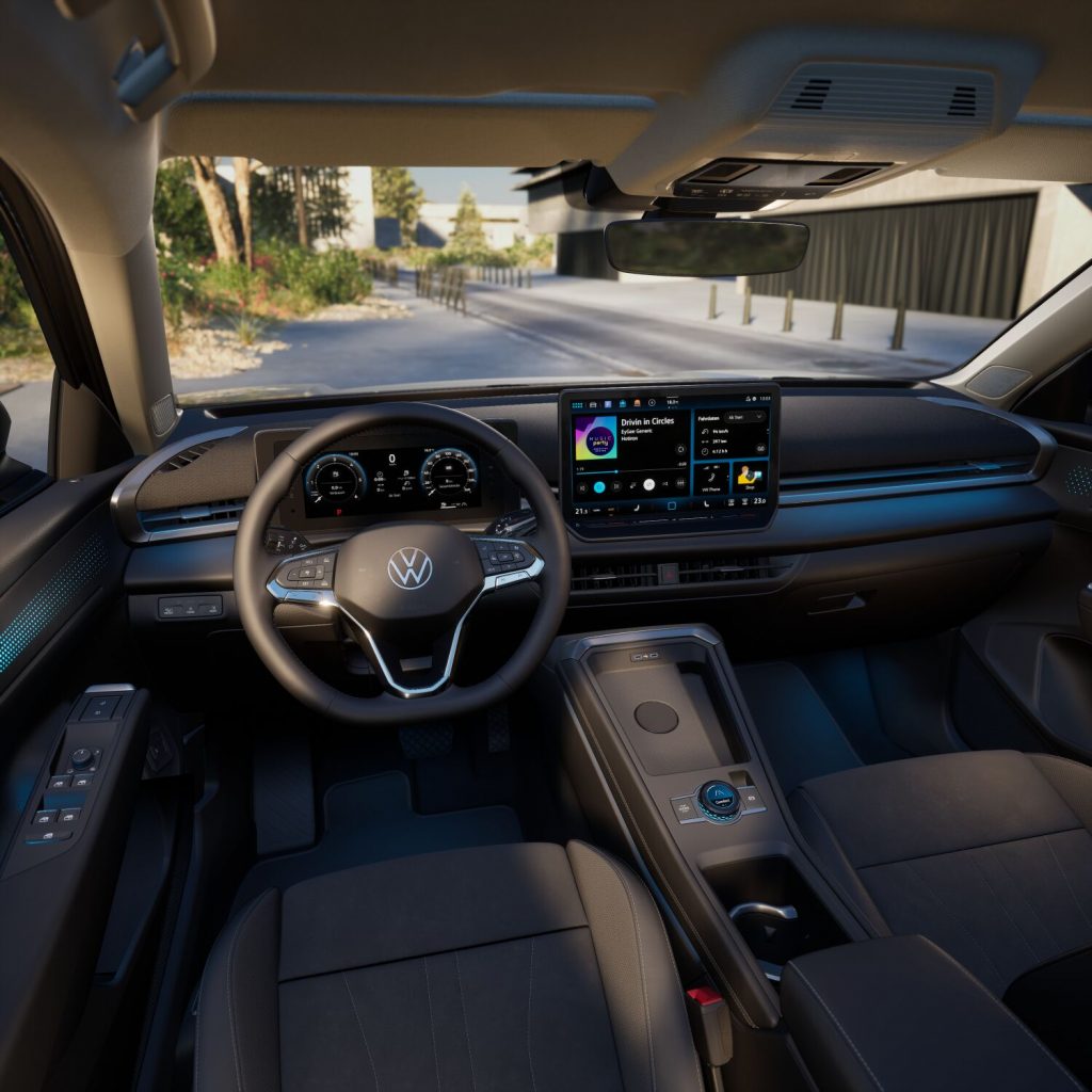 Modern car interior featuring a digital instrument cluster and a large center touchscreen display with a sleek dashboard.